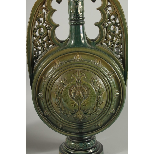 390 - A PAIR OF 19TH CENTURY GREEN HISPANO-MORESQUE GLAZED CERAMIC CANDLESTICKS / VASES, 60cm high.