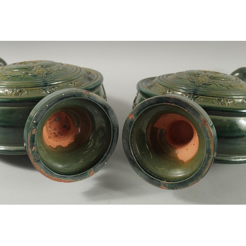 390 - A PAIR OF 19TH CENTURY GREEN HISPANO-MORESQUE GLAZED CERAMIC CANDLESTICKS / VASES, 60cm high.