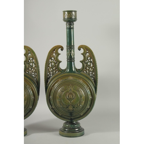 390 - A PAIR OF 19TH CENTURY GREEN HISPANO-MORESQUE GLAZED CERAMIC CANDLESTICKS / VASES, 60cm high.