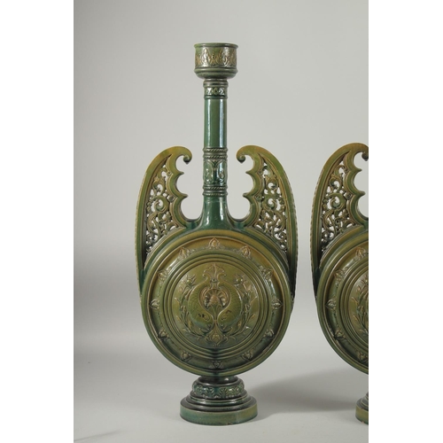 390 - A PAIR OF 19TH CENTURY GREEN HISPANO-MORESQUE GLAZED CERAMIC CANDLESTICKS / VASES, 60cm high.