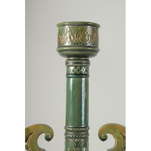 390 - A PAIR OF 19TH CENTURY GREEN HISPANO-MORESQUE GLAZED CERAMIC CANDLESTICKS / VASES, 60cm high.