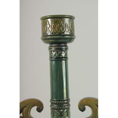 390 - A PAIR OF 19TH CENTURY GREEN HISPANO-MORESQUE GLAZED CERAMIC CANDLESTICKS / VASES, 60cm high.