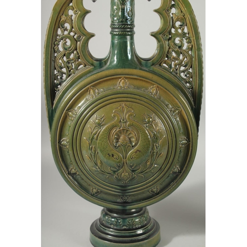 390 - A PAIR OF 19TH CENTURY GREEN HISPANO-MORESQUE GLAZED CERAMIC CANDLESTICKS / VASES, 60cm high.