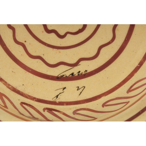 394 - A SPANISH COPPER LUSTRE PLATE FOR THE ISLAMIC MARKET, with calligraphy, 23cm diameter.