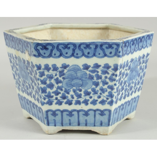 40 - A 19TH CENTURY CHINESE BLUE AND WHITE HEXAGONAL JARDINIERE, painted with foliate decoration, (one re... 