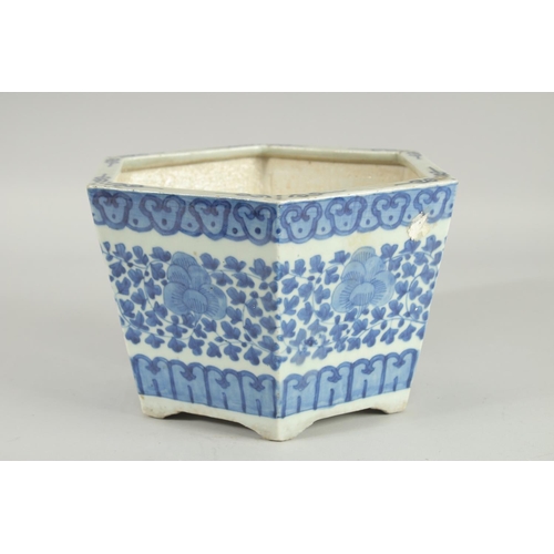 40 - A 19TH CENTURY CHINESE BLUE AND WHITE HEXAGONAL JARDINIERE, painted with foliate decoration, (one re... 