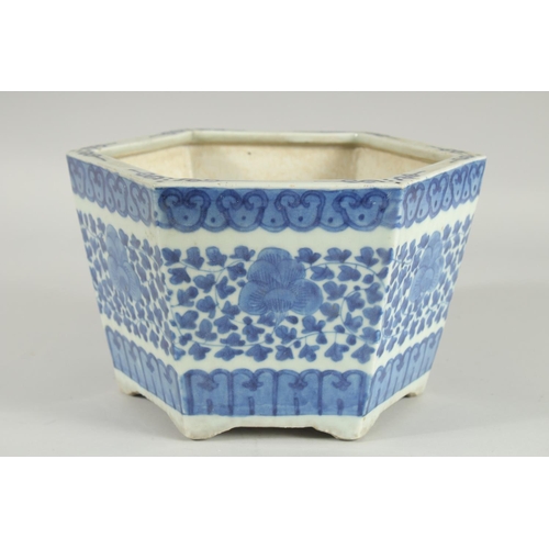 40 - A 19TH CENTURY CHINESE BLUE AND WHITE HEXAGONAL JARDINIERE, painted with foliate decoration, (one re... 