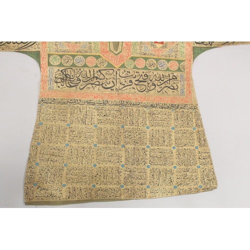 402 - A 20TH CENTURY ISLAMIC OTTOMAN TALISMANIC HAND-PAINTED SHIRT / JAMA, the reverse painted with a pane... 