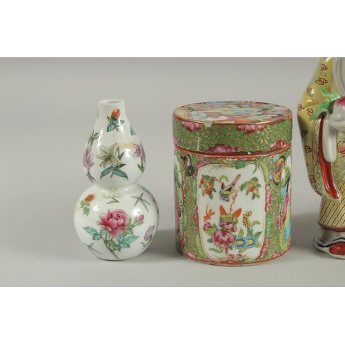 41 - FIVE CHINESE PORCELAIN ITEMS; including two Canton famille rose pots and covers, a figure of an immo... 