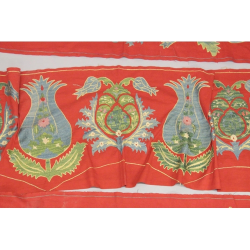 411 - A LARGE UZBEK EMBROIDERED TEXTILE SURROUND, (3 pieces).