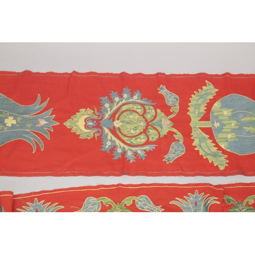 411 - A LARGE UZBEK EMBROIDERED TEXTILE SURROUND, (3 pieces).