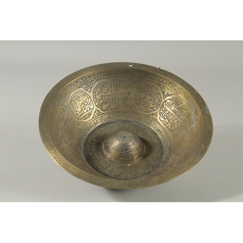 419 - A 19TH CENTURY OTTOMAN BRASS MAGIC BOWL, with engraved calligraphic panels, 20.5cm diameter.