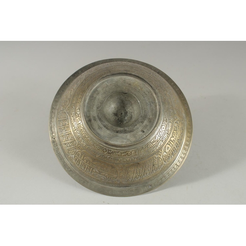 419 - A 19TH CENTURY OTTOMAN BRASS MAGIC BOWL, with engraved calligraphic panels, 20.5cm diameter.