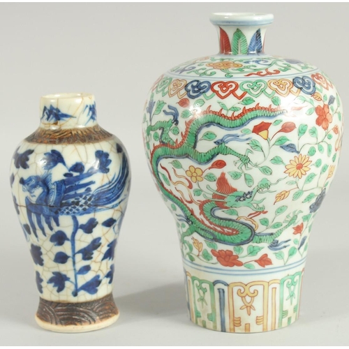 43 - TWO CHINESE PORCELAIN VASES; one 19th century blue and white phioenix vase, the other a wucai dragon... 