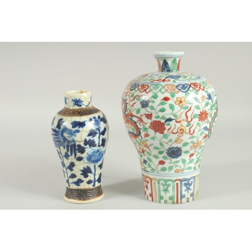 43 - TWO CHINESE PORCELAIN VASES; one 19th century blue and white phioenix vase, the other a wucai dragon... 