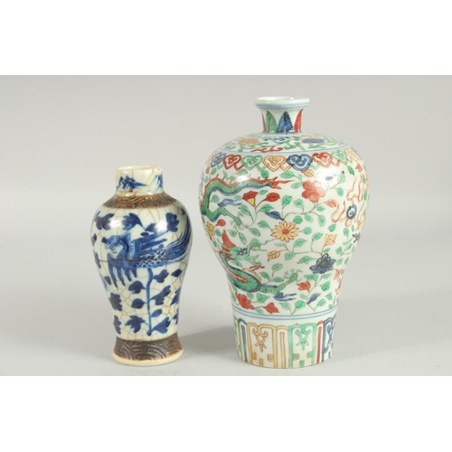 43 - TWO CHINESE PORCELAIN VASES; one 19th century blue and white phioenix vase, the other a wucai dragon... 