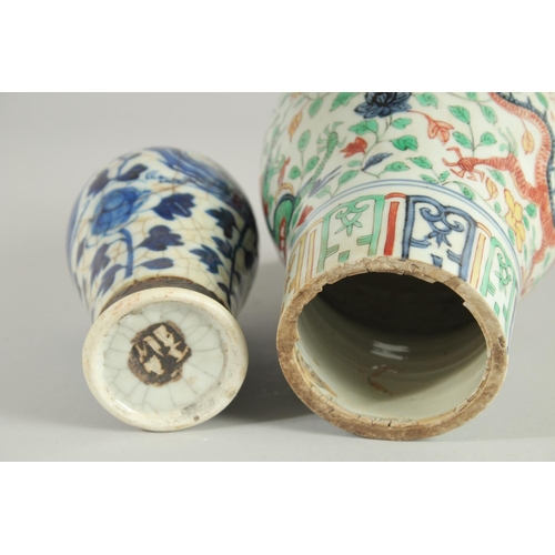 43 - TWO CHINESE PORCELAIN VASES; one 19th century blue and white phioenix vase, the other a wucai dragon... 