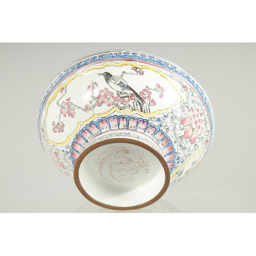 45 - A 19TH CENTURY CHINESE CANTON ENAMEL BOWL, painted with panels of birds and native flora, 13cm diame... 