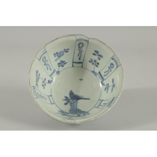 5 - AN 18TH CENTURY NANKING CARGO BLUE AND WHITE PORCELAIN BOWL, decorated with panels of flora and bird... 