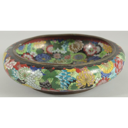 51 - A LARGE CHINESE CLOISONNE BOWL, decorated all over with various colourful flower heads, the base wit... 