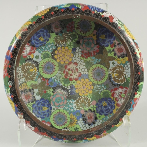 51 - A LARGE CHINESE CLOISONNE BOWL, decorated all over with various colourful flower heads, the base wit... 