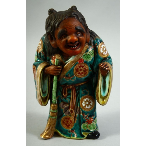 55 - A JAPANESE KUTANI POTTERY FIGURE of Jittoku, 20.5cm high.