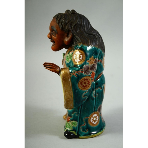 55 - A JAPANESE KUTANI POTTERY FIGURE of Jittoku, 20.5cm high.