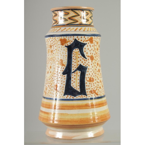 551 - AN ITALIAN GLAZED POTTERY MEDICINE JAR, 24.5cm high.