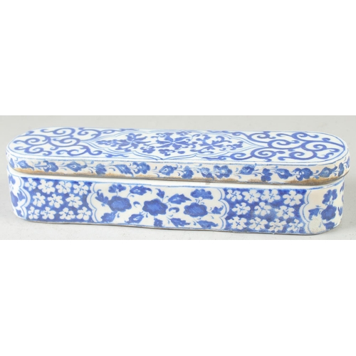 552 - A TURKISH BLUE AND WHITE POTTERY PEN BOX, 28.5cm long.