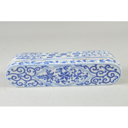 552 - A TURKISH BLUE AND WHITE POTTERY PEN BOX, 28.5cm long.