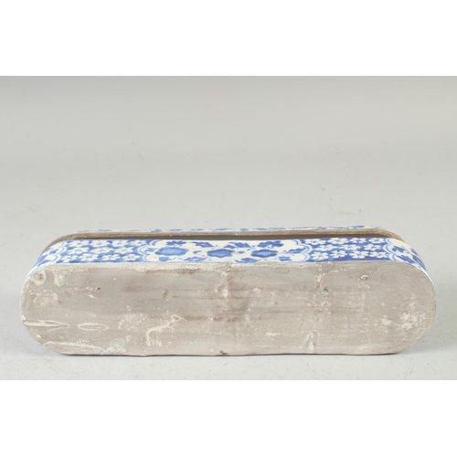 552 - A TURKISH BLUE AND WHITE POTTERY PEN BOX, 28.5cm long.