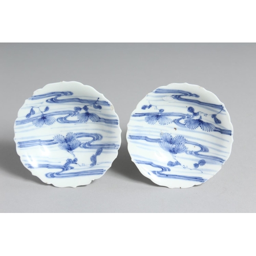 57 - A SMALL PAIR OF JAPANESE HIRADO BLUE AND WHITE PORCELAIN PEDESTAL DISHES. 10cm diameter.