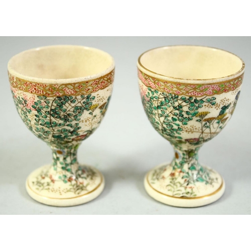 58 - A PAIR OF JAPANESE SATSUMA EGG CUPS, with foliate decoration, 6.5cm high.