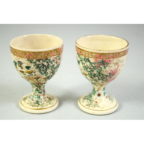 58 - A PAIR OF JAPANESE SATSUMA EGG CUPS, with foliate decoration, 6.5cm high.