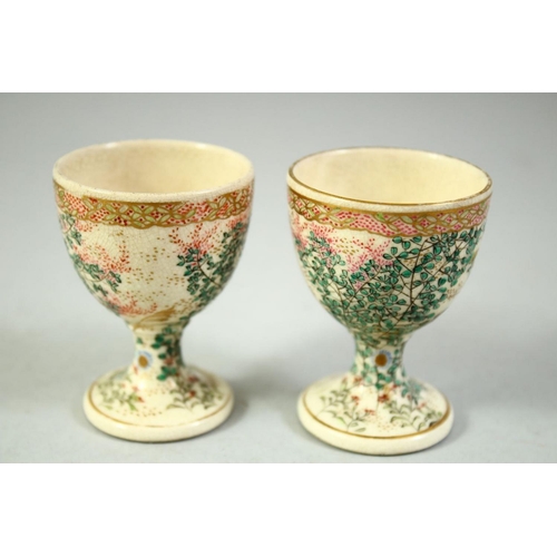 58 - A PAIR OF JAPANESE SATSUMA EGG CUPS, with foliate decoration, 6.5cm high.