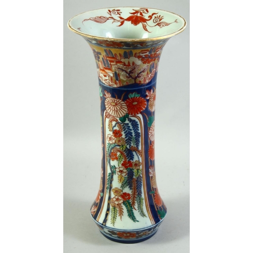 59 - A LARGE JAPANESE IMARI PORCELAIN SLEEVE VASE, painted with a village landscape with panels of flower... 