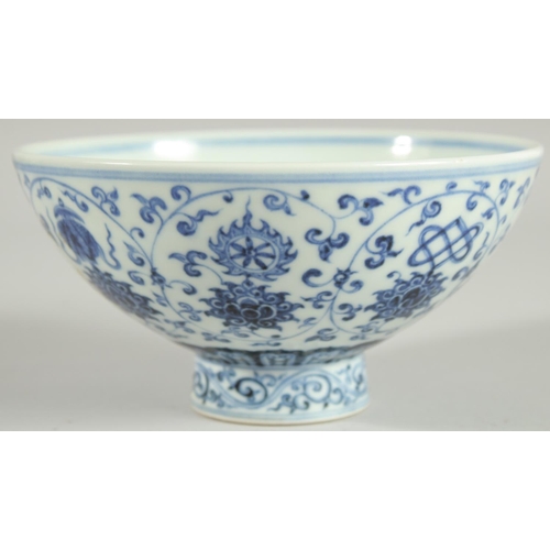 62 - A CHINESE BLUE AND WHITE PORCELAIN FOOTED BOWL, painted with auspicious symbols, 15.5cm diameter.