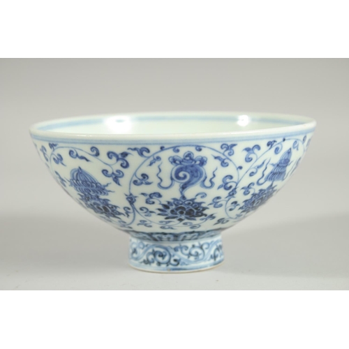 62 - A CHINESE BLUE AND WHITE PORCELAIN FOOTED BOWL, painted with auspicious symbols, 15.5cm diameter.