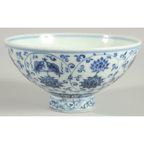 62 - A CHINESE BLUE AND WHITE PORCELAIN FOOTED BOWL, painted with auspicious symbols, 15.5cm diameter.