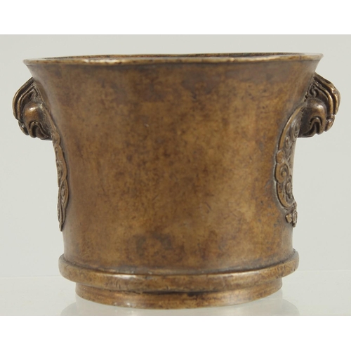 66 - A CHINESE BRONZE TWIN HANDLE CENSER, 8.5cm high.