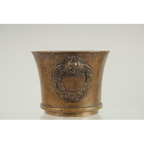 66 - A CHINESE BRONZE TWIN HANDLE CENSER, 8.5cm high.