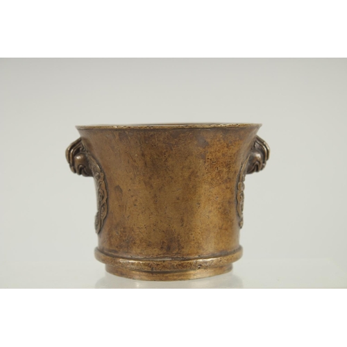 66 - A CHINESE BRONZE TWIN HANDLE CENSER, 8.5cm high.