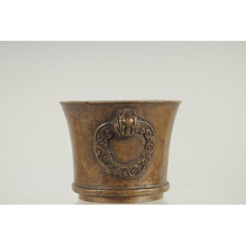 66 - A CHINESE BRONZE TWIN HANDLE CENSER, 8.5cm high.