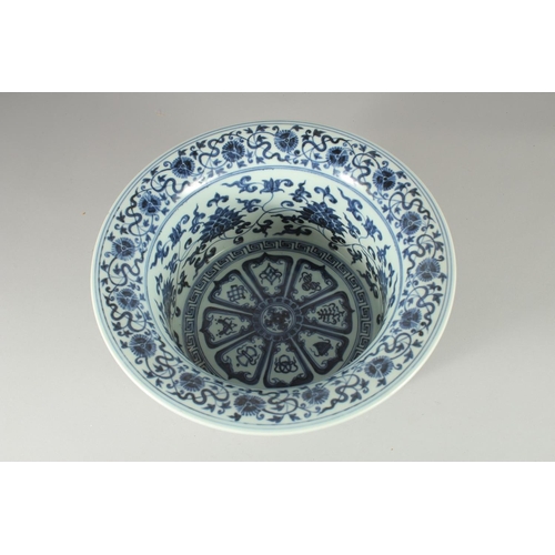 67 - A CHINESE BLUE AND WHITE PORCELAIN WATER BASIN, the interior painted with auspicious symbols and flo... 