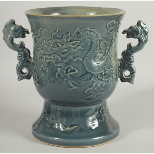 68 - AN IMPRESSIVE CHINESE TWIN HANDLE GOBLET VASE, the body carved with dragon, the handles formed as aq... 