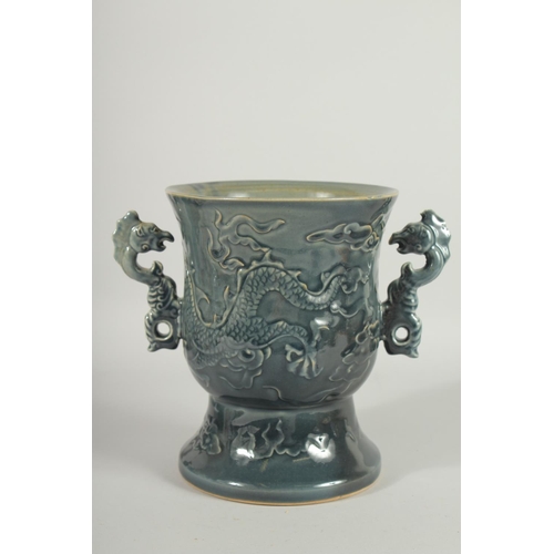 68 - AN IMPRESSIVE CHINESE TWIN HANDLE GOBLET VASE, the body carved with dragon, the handles formed as aq... 