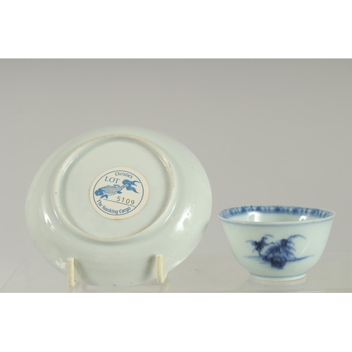 7 - AN 18TH CENTURY NANKING CARGO BLUE AND WHITE PORCELAIN CUP AND SAUCER DISH, with applied collection ... 