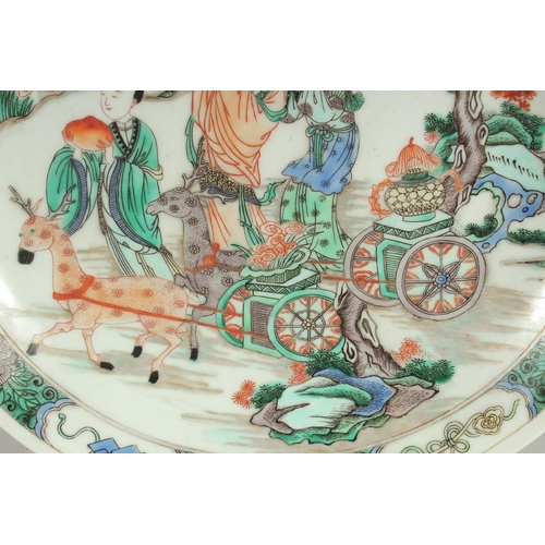 75 - A CHINESE FAMILLE VERTE PORCELAIN PLATE, with female figures and deer, six-character mark to base, 2... 