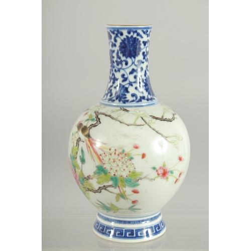 77 - A CHINESE FAMILLE ROSE / BLUE AND WHITE VASE, 19cm high.