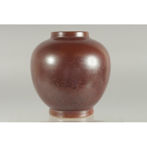 78 - A CHINESE MOTTLED RED GLAZE JAR, character mark to base, 15.5cm high.